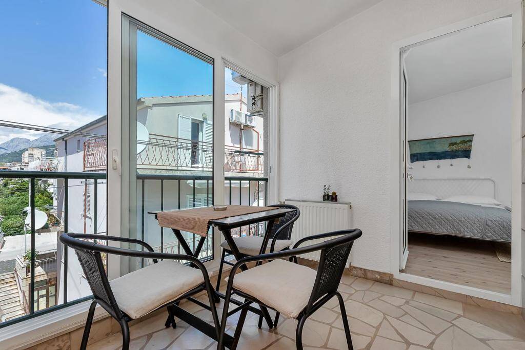 Balcony with garden view - Apartments & Rooms Rica